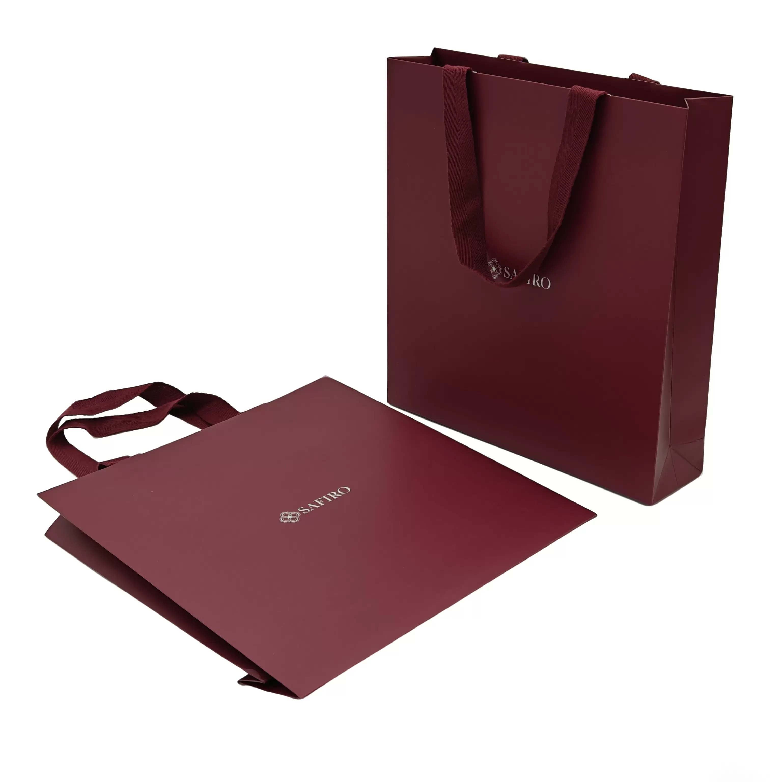 Papiertragetaschen mit Stoffgriffen